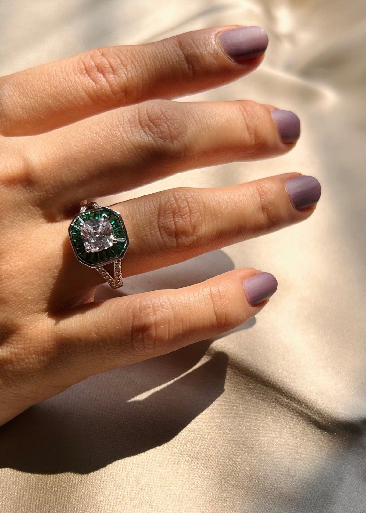 Timeless Solitaire with Tapered Green Gemstone Accents