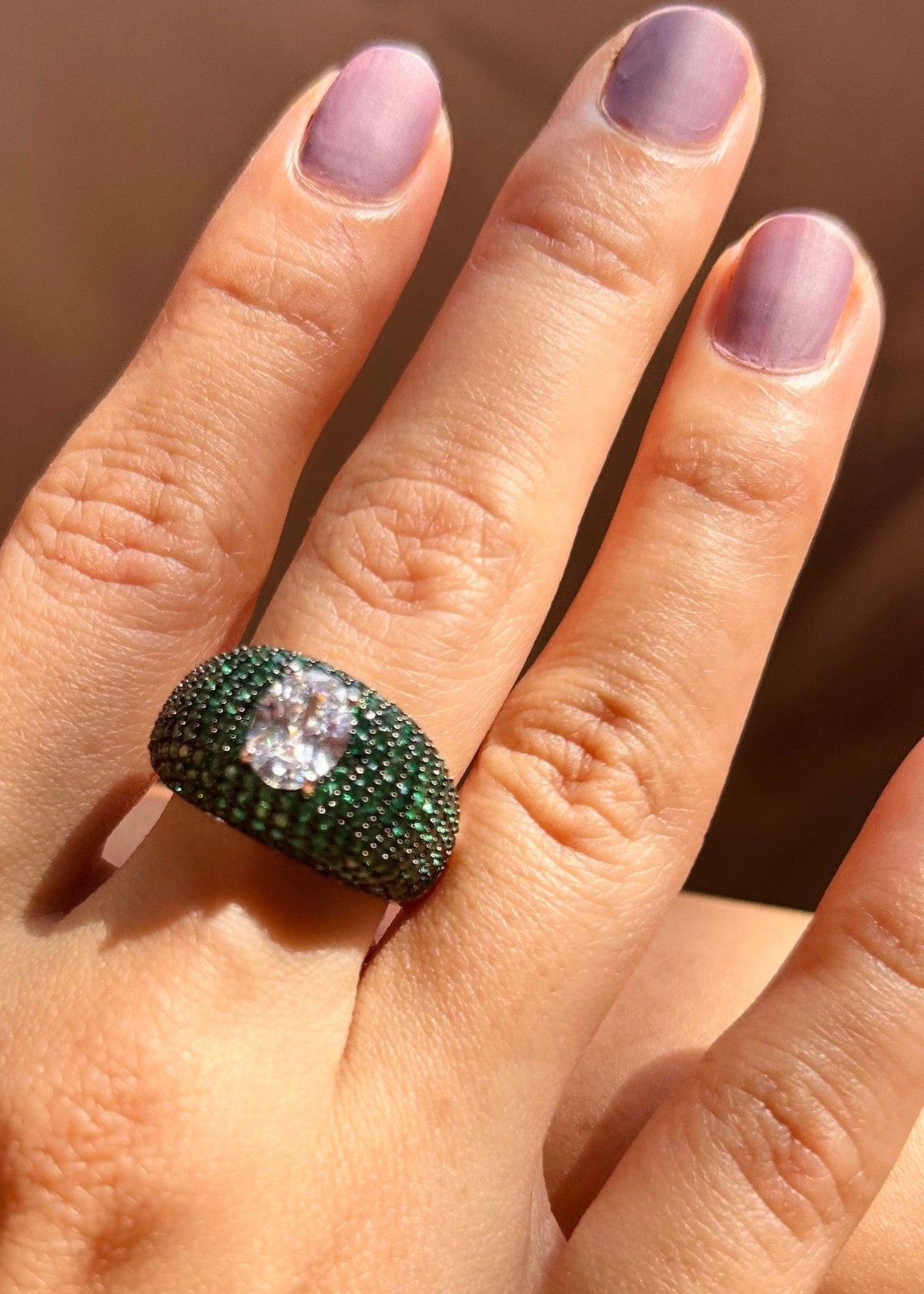 Oval Radiance: Timeless Green Gemstone Solitaire Ring