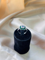 Timeless Solitaire with Tapered Green Gemstone Accents