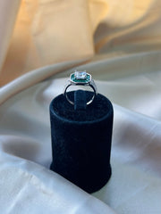 Timeless Solitaire with Tapered Green Gemstone Accents