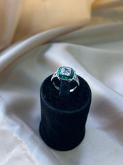 Timeless Solitaire with Tapered Green Gemstone Accents